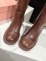 MIUMIU 26S HIGH-ANKLE BOOTS 50MM IN BROWN GLOSSY CALFSKIN