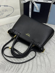 PRADA 25S BUCKLE MEDIUM HANDBAG 28 IN BLACK CALFSKIN GOLD HARDWARE