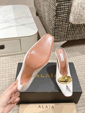 ALAIA SPIKE JEWEL MULES IN WHITE CALFSKIN WITH GOLD HARDWARE