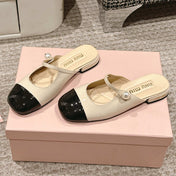 FLAT MULE IN BISQUE BEIGE MIX BLACK PATENT CALFSKIN
