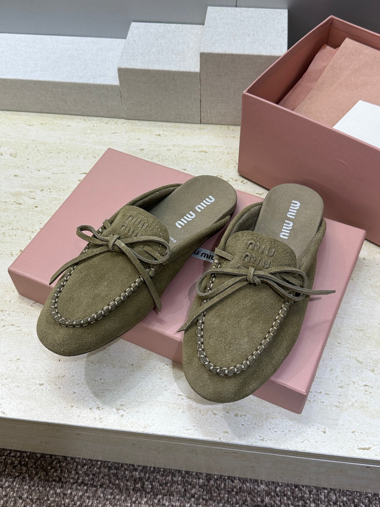 MIUMIU 26S SNEAKER MULES IN DARK OLIVE GREEN SUEDE WITH BOW