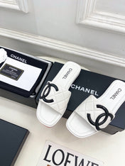 CHANEL 26S FLAT SLIDES IN WHITE LAMBSKIN WITH BLACK CC LOGO