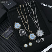 CC 25P STUD EARRINGS IN BLUE DENIM BLACK CALFSKIN-THREADED BUTTON